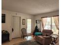 Bright living room with a door to the outside at 8178 Fairways Cir # U201, Ocala, FL 34472