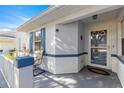 Front entrance with a glass door and welcome mat at 9158 Sw 91St Ter, Ocala, FL 34481