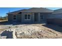 Unfinished house exterior with gray stucco and a brown roof at 3 Willow Trl, Ocala, FL 34472