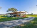 Spacious covered equipment storage area with ample room for tractors and other equipment at 4880 Bannon Island Rd, Haines City, FL 33844