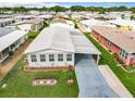 Single-Gathering home with carport and landscaping at 6739 Kensington Ne Dr, Winter Haven, FL 33881