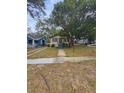 Charming house exterior with landscaping and walkway at 1414 Johns Ave, Haines City, FL 33844