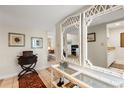 Bright condo entryway with tile flooring, console table, and mirrors reflecting the living room at 2070/2071 Corner Lake Dr # 2, Haines City, FL 33844