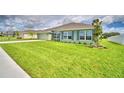 One-story house with green exterior and landscaping at 4024 Tullamore Ln, Auburndale, FL 33823