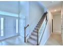 Bright entryway with tile floors and white trim at 1409 Leamington Ln, Winter Haven, FL 33884