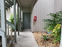 Condo hallway with green door and stairs at 4171 Abbey Ct # 4171, Haines City, FL 33844