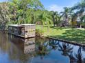 Scenic waterfront view with private dock and lush landscape at 6168 Arborea Dr, Lake Wales, FL 33898