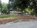 Gray house exterior with screened porch and fenced yard at 152 E Grove Dr, Haines City, FL 33844