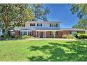Two-story house with brick and white siding, large yard at 1950 El Paso Trl, Bartow, FL 33830