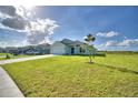 House exterior showcasing a new build in a neighborhood setting with ample green space at 4073 Tullamore Ln, Auburndale, FL 33823