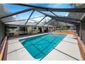 Inviting, screened-in pool with ample deck space at 8881 Cypresswood Dr, Lake Wales, FL 33898