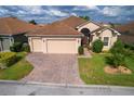 Two-car garage and nicely landscaped yard at 4568 Back Nine Dr, Winter Haven, FL 33884