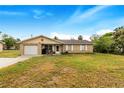 Brick ranch house with attached garage and spacious yard at 329 N 19Th St, Haines City, FL 33844