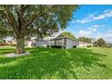 House with mature tree and well-manicured lawn at 4353 Dinner Lake Dr, Lake Wales, FL 33859