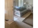 Living room with wicker couch and entryway at 400 El Camino Dr # 223, Winter Haven, FL 33884