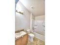 Clean bathroom with tub, shower, and granite vanity at 1269 Tagliamento Ln, Haines City, FL 33844