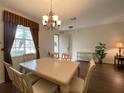 Dining room with hardwood floors and chandelier at 3093 Dunmore Dr, Lake Wales, FL 33859
