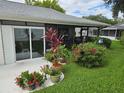 Backyard patio with lush landscaping and plants at 3130 Prairie Dunes W Cir, Lakeland, FL 33810