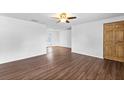 Bright living room with wood-look floors and ceiling fan at 1510 Richmond Rd, Lakeland, FL 33801