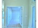 Open hallway with doors to adjacent rooms, offering a sense of spaciousness at 1273 Tagliamento Ln, Haines City, FL 33844
