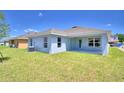 View of the home's back and side yards at 1261 Tagliamento Ln, Haines City, FL 33844