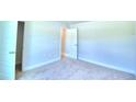 Bright bedroom with carpeted floors and access to closet at 1261 Tagliamento Ln, Haines City, FL 33844