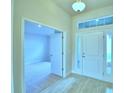 Bright and airy entryway with tile flooring and open view to living area at 1257 Tagliamento Ln, Haines City, FL 33844