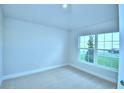 Simple bedroom with carpeted floor and window at 1249 Tagliamento Ln, Haines City, FL 33844