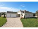 New construction home with three-car garage and paver driveway at 1793 Lakehill Dr, Winter Haven, FL 33884