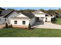 Aerial view of a single-Gathering home with a large paved driveway and landscaped lawn at 1793 Lakehill Dr, Winter Haven, FL 33884