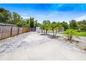 Landscaped front yard with a paved driveway at 1004 Avenue G Ne, Winter Haven, FL 33881
