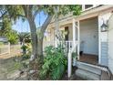 House exterior with porch, landscaping, and white picket fence at 319 N Wales Dr, Lake Wales, FL 33853