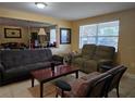 Spacious living room featuring comfortable seating and large windows at 2031 Poe St, Lakeland, FL 33801
