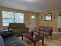 Bright living room featuring comfy sofas and a coffee table at 2031 Poe St, Lakeland, FL 33801