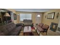 Living room with sofas, a coffee table and a view of the entrance at 2031 Poe St, Lakeland, FL 33801
