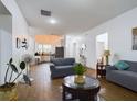Open concept living room and kitchen with hardwood floors at 169 Violet Ct, Kissimmee, FL 34759