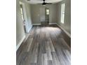 Bright living room featuring modern vinyl plank flooring at 454 Avenue I Se, Winter Haven, FL 33880