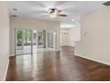 Living room with hardwood floors, sliding glass doors and a view to the patio at 4432 Waterford Dr, Lake Wales, FL 33859