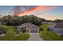 Aerial view of a single-story house with a large front yard and driveway at 1067 Snively Cir, Lake Hamilton, FL 33851