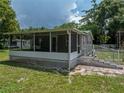 House with a screened porch and a large yard at 14813 Camp Mack Rd, Lake Wales, FL 33898