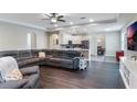 Spacious living area with a sectional sofa and open sightlines to the kitchen and dining area at 329 Lake Vista Dr, Auburndale, FL 33823
