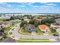 Aerial view of house and neighborhood, showcasing lake access at 329 Lake Vista Dr, Auburndale, FL 33823