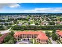 Aerial view of community with a wide variety of homes and landscape at 902 Charo Pkwy # 624, Davenport, FL 33897