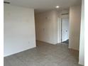 Open concept living room with tile floors and neutral colors at 177 Cimarron Ln, Kissimmee, FL 34759