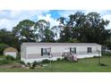 Single-wide manufactured home with basketball court at 1815 Christy Ln, Lakeland, FL 33801