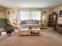 Spacious living room with seating, coffee table and bookcase at 191 Sweet Cir, Winter Haven, FL 33884