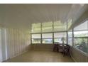 Sunroom with tiled floor and ample natural light at 807 Elizabeth Ln, Lakeland, FL 33809