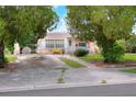 Ranch style home with driveway and mature landscaping at 512 N 4Th St, Haines City, FL 33844