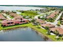Aerial view showing a townhome next to a lake at 1202 Ashton Palms Dr # 6, Lake Wales, FL 33859
