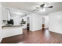 Living room with dark wood floors and an open floor plan at 3050 Cross Fox Dr, Mulberry, FL 33860